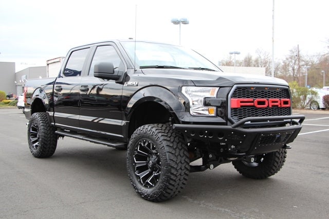 Black Custom Lifted F-150 with Red Grille at All American Ford of Paramus in Paramus NJ