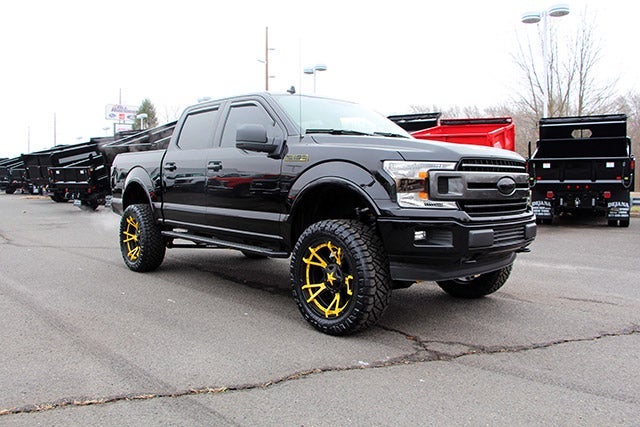 Custom Black F-150 with Jimmie Allen Yellow Rims at All American Ford of Paramus in Paramus NJ