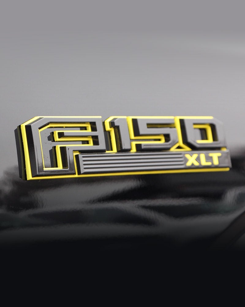 Custom Black & Yellow Emblems at All American Ford of Paramus in Paramus NJ